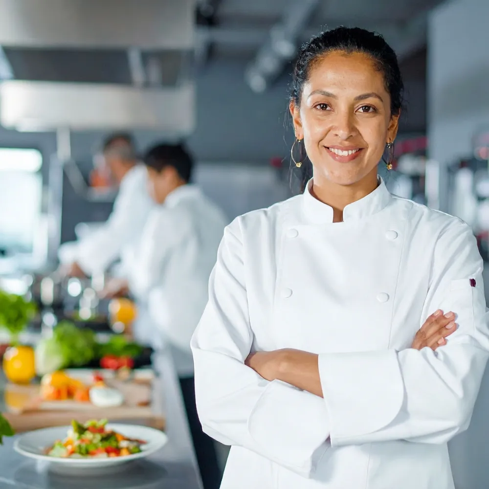Chef in double-breasted whites in a commercial kitchen