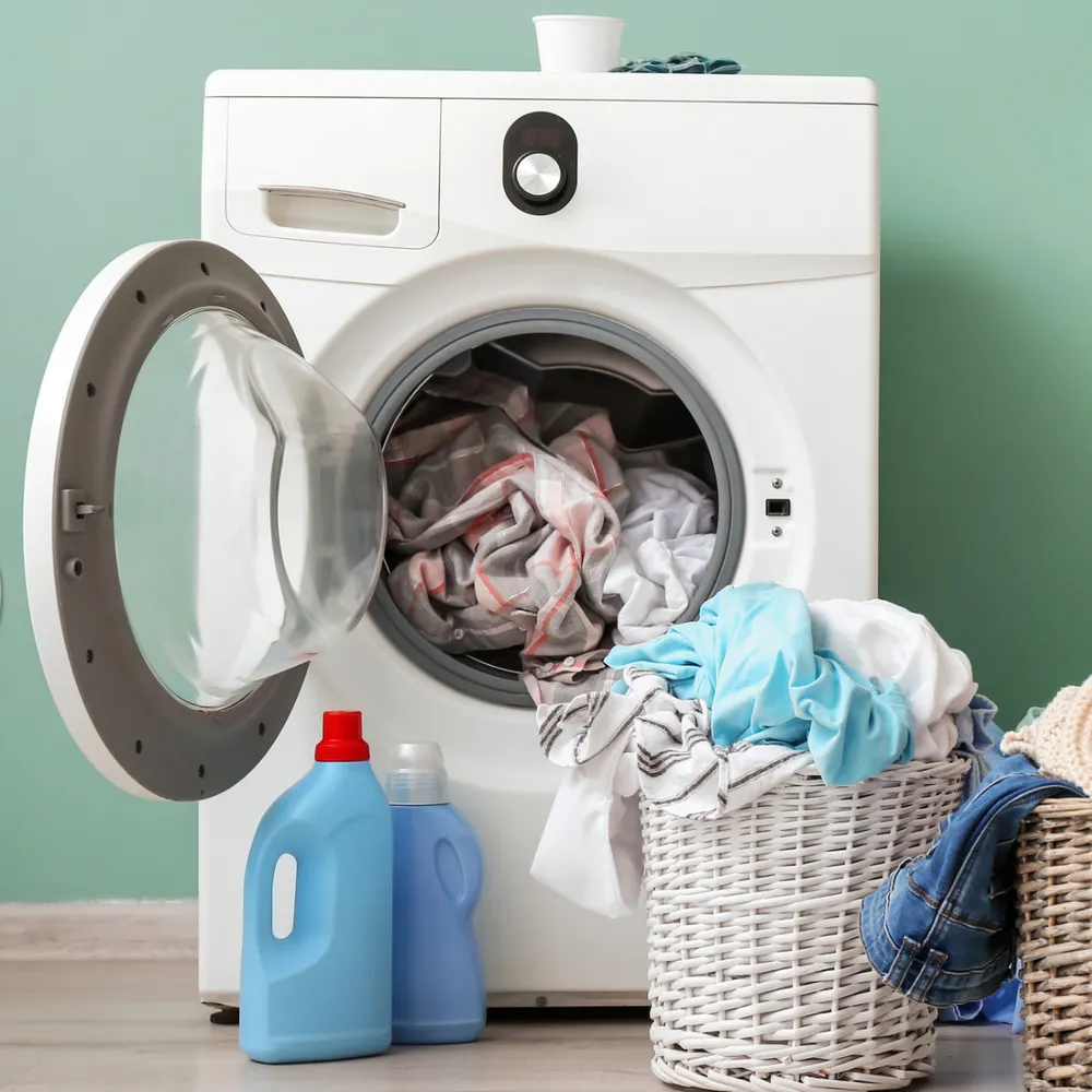 Domestic washing machine with a laundry basket