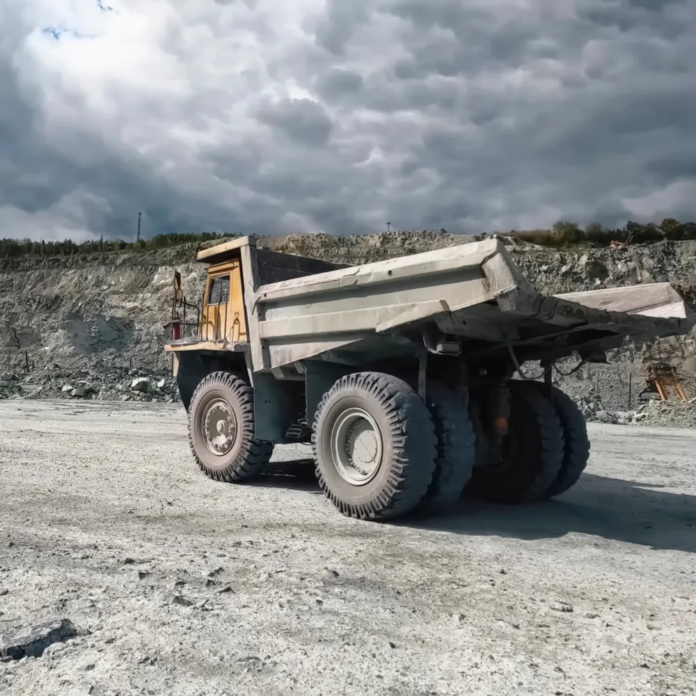 Rigid dump truck on a haul road in a working quarry