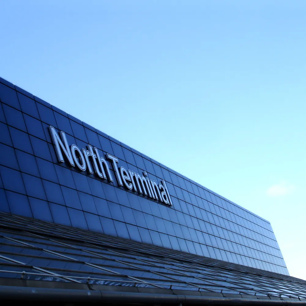 Airport terminal facade against a clear sky