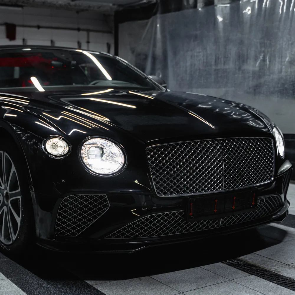 Handcrafted luxury car in a detailing bay