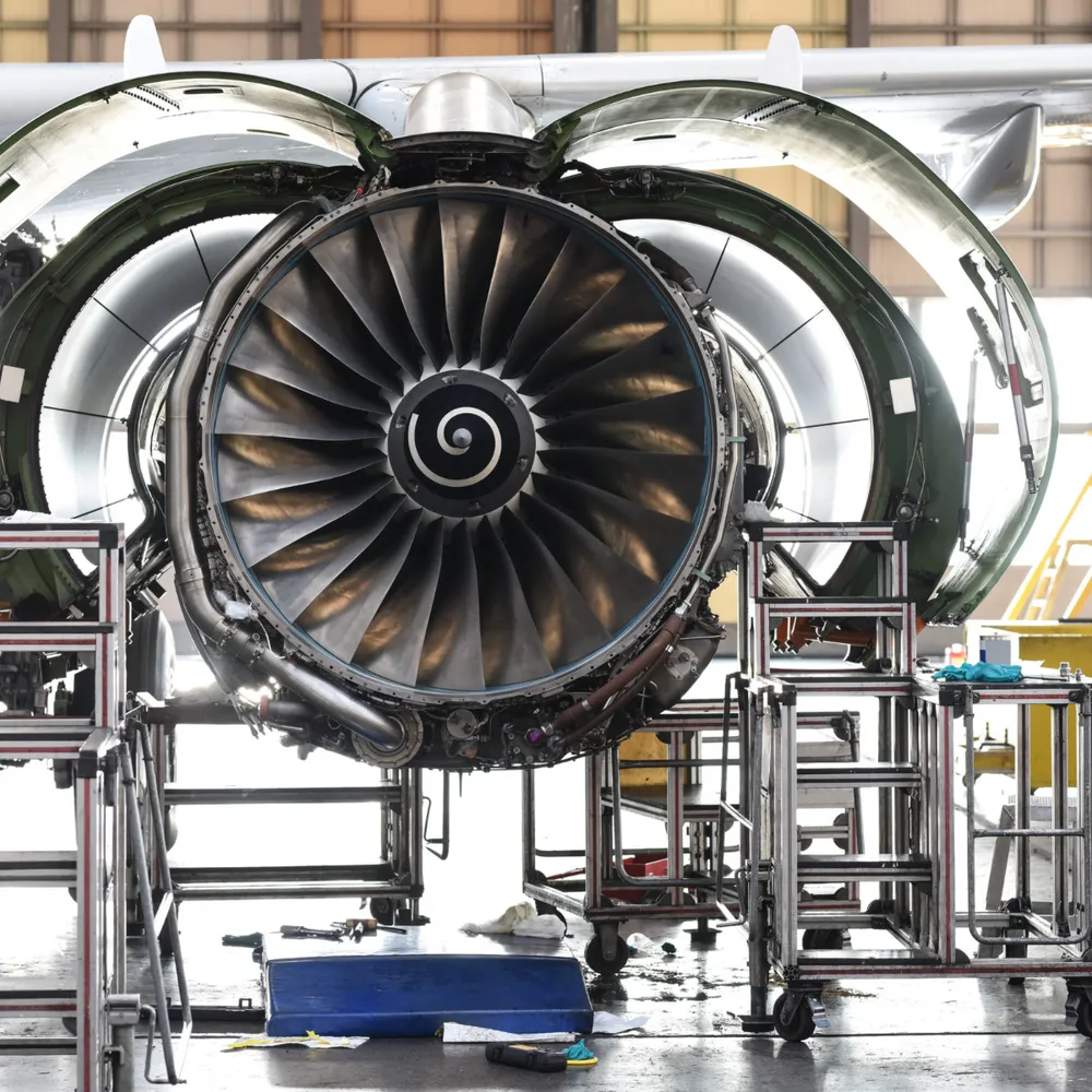 Aircraft jet engine open for maintenance in a hangar