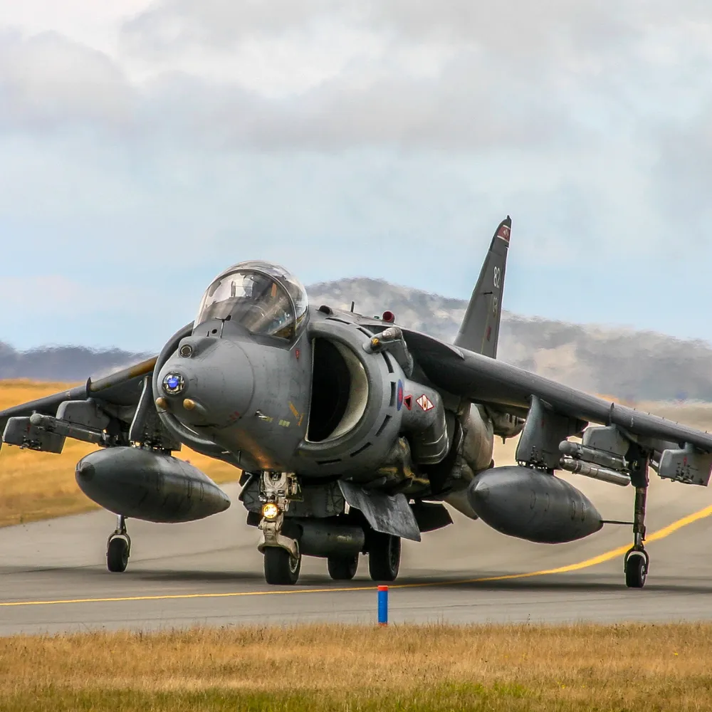 Military jet taxiing on a runway