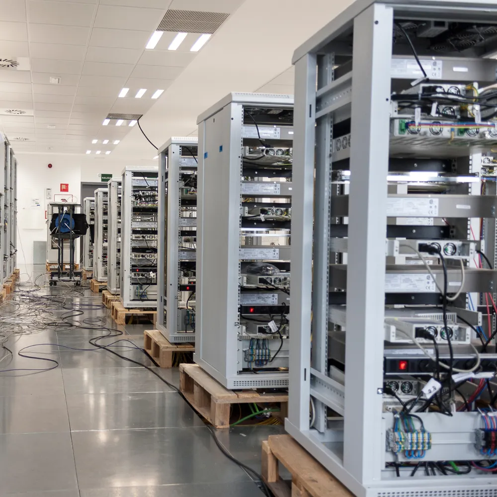 Equipment racks lined up in a technology facility